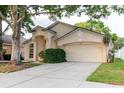 Beautiful one-story home featuring a two-car garage and well-maintained landscaping at 24839 Wild Frontier Dr, Land O Lakes, FL 34639