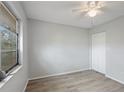 Comfortable bedroom featuring new flooring, a ceiling fan and a closet at 314 Barlow Ave # 73, Sarasota, FL 34232