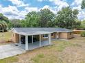 Brick home featuring a covered carport, bay window, and mature trees in the yard at 4323 Culbreath Rd # B, Valrico, FL 33596