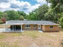 Brick home with a convenient covered carport, bay window, and lush trees adding to the curb appeal at 4323 Culbreath Rd # B, Valrico, FL 33596