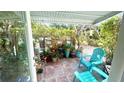Covered patio with colorful decor and comfortable seating, perfect for outdoor relaxation at 4570 Overlook Ne Dr # 180, St Petersburg, FL 33703
