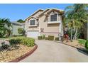 Attractive home featuring beautiful landscaping and an extended driveway at 6121 Fjord Way, New Port Richey, FL 34652