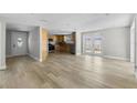 Spacious open-concept living area with modern flooring and ample natural light at 6812 Fountain Ave, Tampa, FL 33634