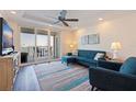 Comfortable living room featuring a modern ceiling fan and view of the water at 7922 Sailboat Key S Blvd # 105, South Pasadena, FL 33707