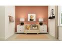 Stylish Bedroom with a crib, lion art, and coordinating decor creates a warm and inviting space at 9582 Runaway Breeze Dr, Land O Lakes, FL 34637