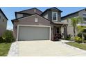 Charming two-story home with manicured garden and a two car garage at 9616 Lemon Drop Loop, Sun City Center, FL 33573