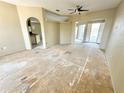 Open living space with sliding doors to backyard and a ceiling fan at 1145 Riveredge Dr, Tarpon Springs, FL 34689