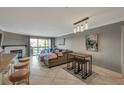 Living room showcasing a couch, small table, bar stools, and open concept to the kitchen at 2400 Feather Sound Dr # 1136, Clearwater, FL 33762