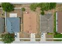 An aerial shot showcasing the property's roof, surrounding yards, and neighborhood layout at 24305 Denali Ct, Lutz, FL 33559