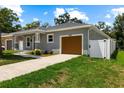 Lovely home with a one-car garage and a long driveway, perfect for extra parking at 2906 E Columbus Dr, Tampa, FL 33605