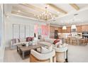 Inviting living room filled with natural light, features stylish furniture, and offers an open floor plan at 32249 Tribeca Ave, Wesley Chapel, FL 33543