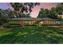 Beautiful one-story home with lush lawn and mature trees, perfect for serene living at 3416 W Morrison Ave, Tampa, FL 33629