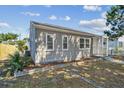 This delightful one-story home showcases a neat exterior, a welcoming porch, and tidy landscaping at 3535 16Th N St, St Petersburg, FL 33704