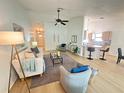Inviting living room with vaulted ceiling flowing into kitchen, creating an open and airy atmosphere at 3621 102Nd N Pl, Clearwater, FL 33762