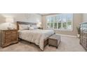Comfortable bedroom with neutral tones, plantation shutters, and a plush king-size bed at 4165 San Severo Rd, Wesley Chapel, FL 33543
