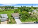 A well-maintained home with a lush front yard and an inviting driveway at 4500 Great Lake S Dr, Clearwater, FL 33762