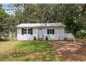 Charming single-story home featuring a white exterior with black shutters at 4522 5Th St, Zephyrhills, FL 33542