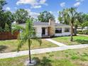 Beautiful home featuring a stone chimney, dark framed windows, and a stone walkway at 4560 7Th N Ave, St Petersburg, FL 33713