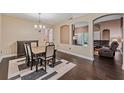 Dining room adjacent to an open living area, perfect for entertaining guests at 6038 Palomaglade Dr, Lithia, FL 33547