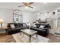 Inviting living room with comfortable leather sofas and an open floor plan to the kitchen at 6420 92Nd N Pl # 1205, Pinellas Park, FL 33782