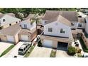 Inviting two-story townhome with attached garage and mature landscaping at 6980 Ulmerton Rd # 7C, Largo, FL 33771