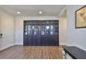 Home office featuring a large built in book case and attractive flooring at 7307 S Morton St, Tampa, FL 33616