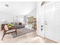 Bright and airy living room featuring hardwood floors, large windows, and a comfortable seating area at 10357 Lightner Bridge Dr, Tampa, FL 33626