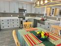 Well-appointed kitchen with stainless steel appliances, granite countertops and a farm style sink at 10607 Boyette Creek Blvd, Riverview, FL 33569