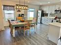 Modern kitchen with stainless steel appliances, granite countertops, and a breakfast nook area at 10607 Boyette Creek Blvd, Riverview, FL 33569