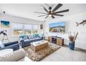 Bright living room with a large window view, comfortable seating, modern decor, and tiled floors at 1120 N Shore Ne Dr # 804, St Petersburg, FL 33701