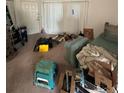 Image shows an untidy living room with furniture and boxes at 135 Pinewinds Blvd, Oldsmar, FL 34677