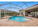 Inviting covered pool and patio area, great for entertaining and relaxing outdoors at 19107 Avenue Bayonnes, Lutz, FL 33558