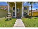 Eye-catching front entrance to home featuring a walkway and a decorative fountain at 27012 Sea Breeze Way, Wesley Chapel, FL 33544