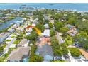 Stunning aerial view of a waterfront property highlighting its prime location and lush surroundings at 315 Ridge Rd, Palm Harbor, FL 34683