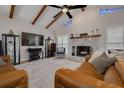Inviting living room with a cozy fireplace, neutral decor, and a comfortable seating arrangement at 315 Ridge Rd, Palm Harbor, FL 34683