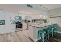 Modern kitchen features stainless steel appliances, granite countertops, and a breakfast bar at 400 Island Way # 1709, Clearwater Beach, FL 33767