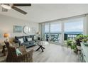 Bright living room features a balcony with ocean views and stylish furnishings at 400 Island Way # 1709, Clearwater Beach, FL 33767