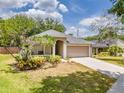 Attractive home with a well-kept lawn and a convenient, attached two-car garage at 412 Henderson Ave, Seffner, FL 33584
