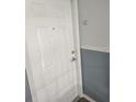 Solid front door, unit D, provides security and privacy for the home at 4872 Beach Se Dr # D, St Petersburg, FL 33705