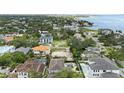 Overview of vacant land in a residential area, perfect for building a dream home near mature trees and landscaping at 5029 W Dickens Ave, Tampa, FL 33629