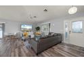 Inviting living room with stylish furniture, modern decor, and wood-look floors at 5193 Boyle Ter, Port Charlotte, FL 33981