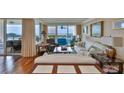 A living room showcases a sitting area and balcony access to the water views at 5701 Mariner St # 701, Tampa, FL 33609