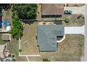 Aerial view of the property showing the roof, yard, and surrounding neighborhood at 10101 Langan St, Spring Hill, FL 34608