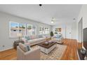 Bright living room with hardwood floors, a ceiling fan, and ample natural light at 11762 82Nd Ter, Seminole, FL 33772