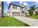 Charming two-story home features well-manicured landscaping, a spacious driveway, and a two-car garage at 13529 Wild Ginger St, Riverview, FL 33579