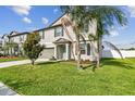 Charming two-story home features well-manicured landscaping, a spacious driveway, and a two-car garage at 13529 Wild Ginger St, Riverview, FL 33579