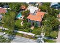 An aerial view of a luxurious home with a pool and lush landscaping at 136 W Davis Blvd, Tampa, FL 33606