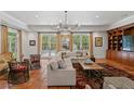Bright living room with terracotta tile flooring, decorative rug, and french doors at 136 W Davis Blvd, Tampa, FL 33606
