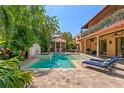 Inviting backyard pool and spa area with ample seating and privacy at 136 W Davis Blvd, Tampa, FL 33606