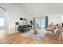 Bright living room with hardwood floors and sliding glass doors at 1624 Shady Leaf Dr, Valrico, FL 33596